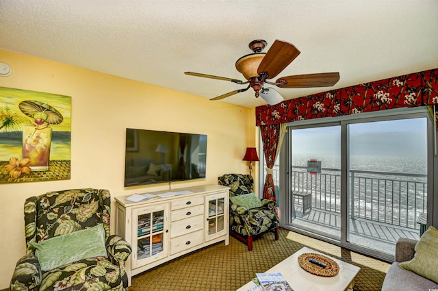 2007 S Ocean Blvd Unit 1106, Myrtle Beach, SC 29577 - living area featuring a ceiling fan, carpet flooring, and a textured ceiling