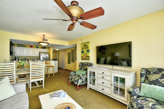 2007 S Ocean Blvd Unit 1106, Myrtle Beach, SC 29577 - living area featuring light colored carpet, a ceiling fan, and a textured ceiling