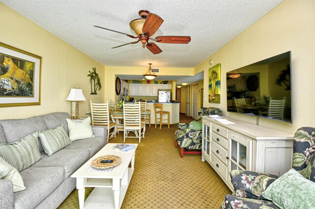 2007 S Ocean Blvd Unit 1106, Myrtle Beach, SC 29577 - living area featuring a textured ceiling, ceiling fan, and light colored carpet
