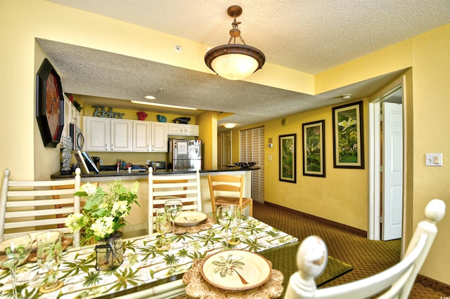 2007 S Ocean Blvd Unit 1106, Myrtle Beach, SC 29577 - dining room with a textured ceiling and dark carpet