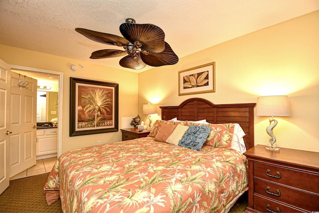 2007 S Ocean Blvd Unit 1106, Myrtle Beach, SC 29577 - bedroom with light tile patterned flooring, ensuite bath, and ceiling fan