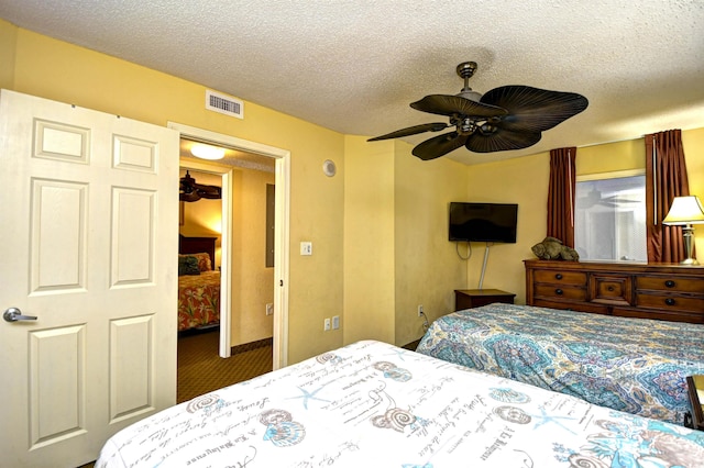 2007 S Ocean Blvd Unit 1106, Myrtle Beach, SC 29577 - bedroom with a textured ceiling, carpet, and a ceiling fan