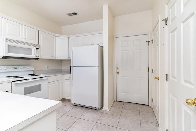 242 Sun Colony Blvd Unit 203, Longs, SC 29568 - kitchen featuring light tile patterned floors, white appliances, light countertops, and white cabinets