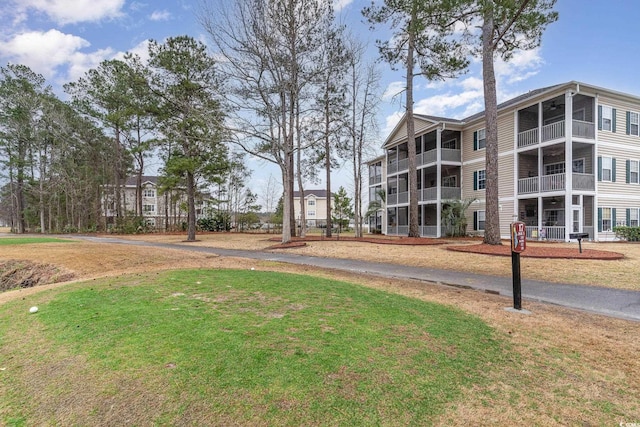 242 Sun Colony Blvd Unit 203, Longs, SC 29568 - surrounding community with a yard