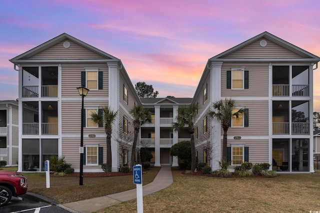 242 Sun Colony Blvd Unit 203, Longs, SC 29568 - view of building exterior with uncovered parking