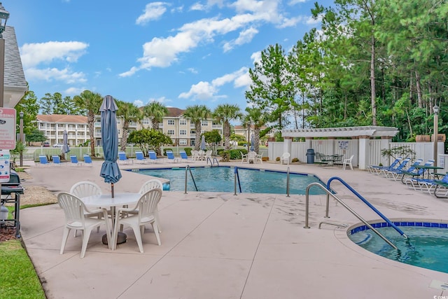 242 Sun Colony Blvd Unit 203, Longs, SC 29568 - community pool with fence and a patio area