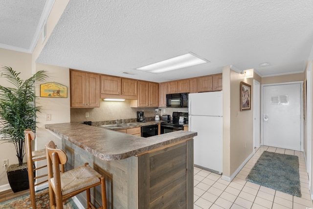 kitchen with a breakfast bar, ornamental molding, a peninsula, black appliances, and a sink