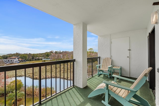 balcony featuring a water view