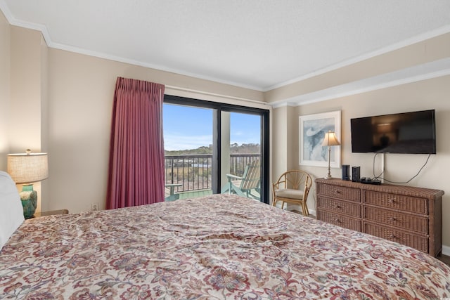 bedroom with ornamental molding and access to outside