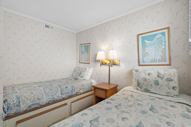 bedroom featuring visible vents, wallpapered walls, and ornamental molding