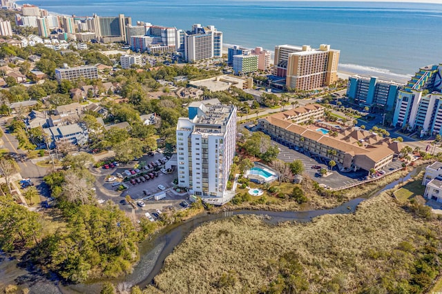 drone / aerial view with a view of city and a water view