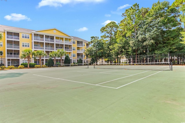 view of sport court featuring fence