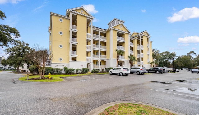 view of property with uncovered parking