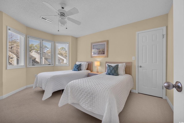bedroom featuring baseboards, a ceiling fan, carpet, and visible vents