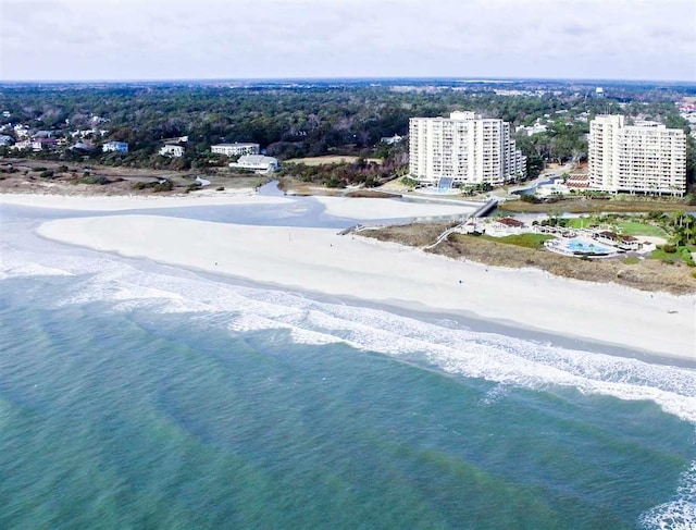 drone / aerial view featuring a view of the beach and a water view