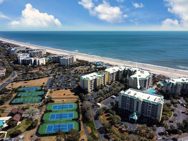 drone / aerial view featuring a view of the beach, a view of city, and a water view