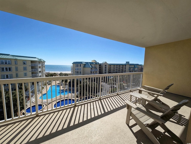 balcony featuring a water view