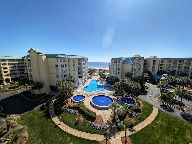 view of pool featuring a water view