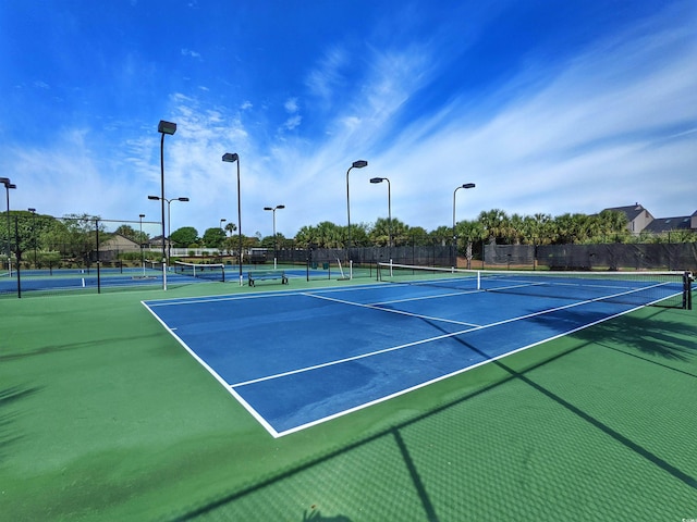 view of tennis court with fence