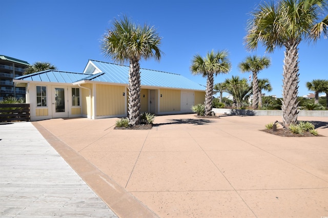 view of front of property with metal roof and a standing seam roof