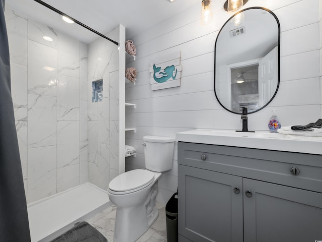 full bathroom featuring visible vents, toilet, marble finish floor, a stall shower, and vanity