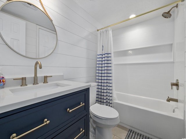 full bathroom featuring vanity, tile patterned floors, toilet, and shower / bath combo