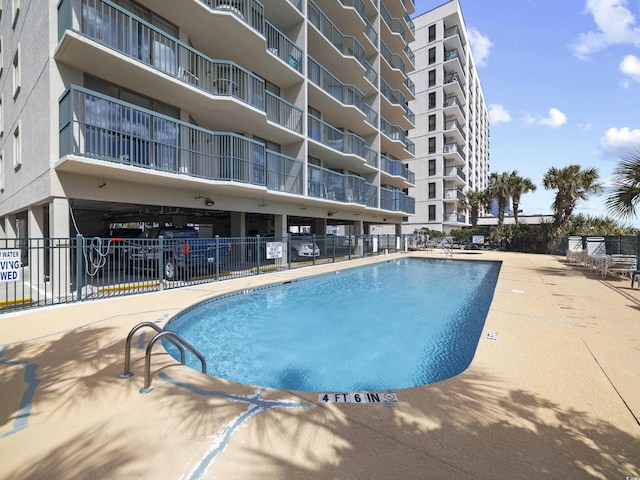 pool featuring fence