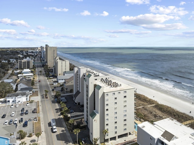 bird's eye view with a water view and a view of the beach