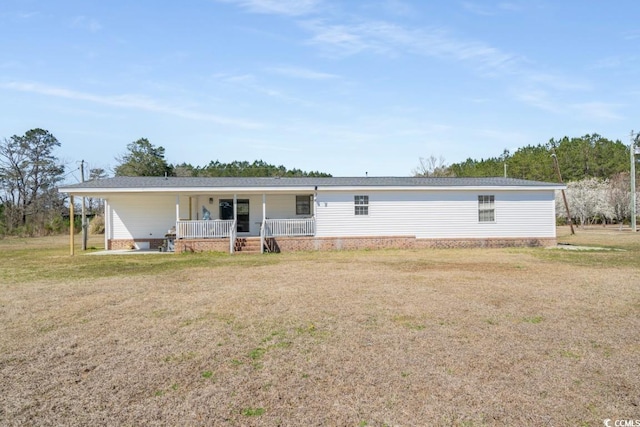 back of house with a yard and covered porch