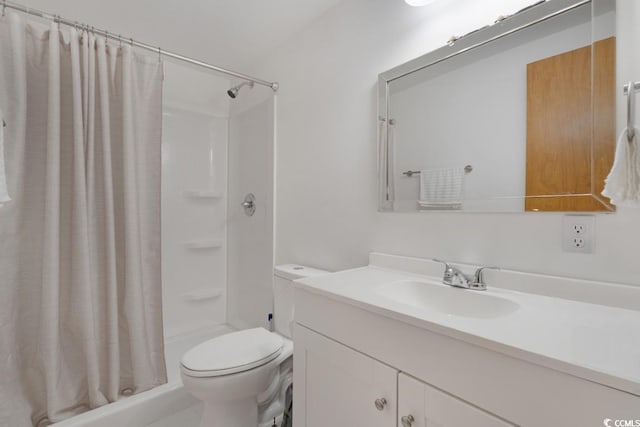 bathroom featuring curtained shower, toilet, and vanity