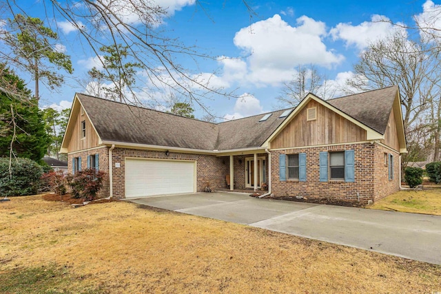 view of front of home featuring brick siding, a shingled roof, a front lawn, concrete driveway, and an attached garage