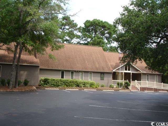 view of property with uncovered parking