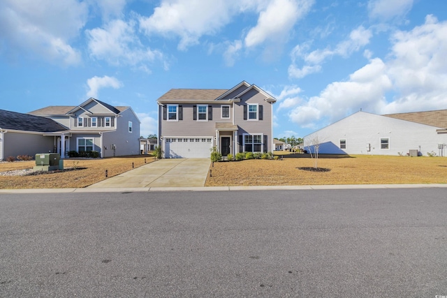 view of front of property with a garage, concrete driveway, and a front lawn