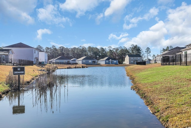 water view with fence and a residential view