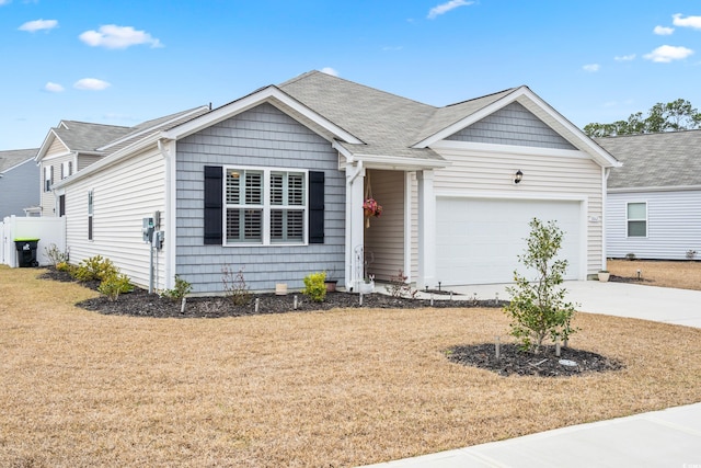 ranch-style home with a front lawn, concrete driveway, a garage, and roof with shingles