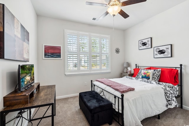 bedroom with visible vents, carpet floors, baseboards, and ceiling fan