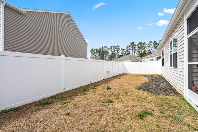 view of yard featuring a fenced backyard