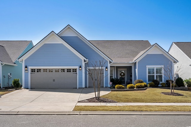 single story home featuring a front yard, a garage, and driveway