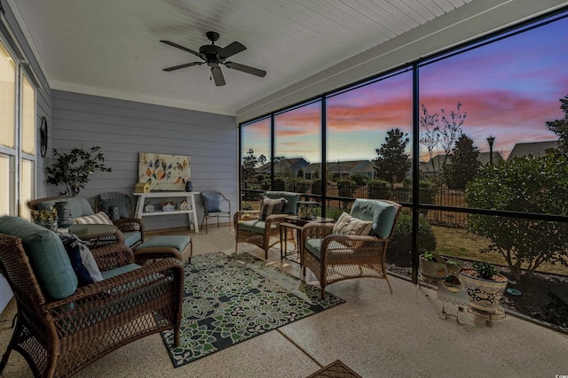 sunroom featuring a wealth of natural light and ceiling fan