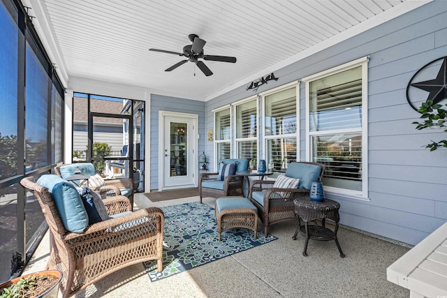 sunroom / solarium featuring ceiling fan