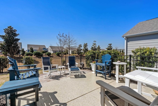 view of patio featuring fence