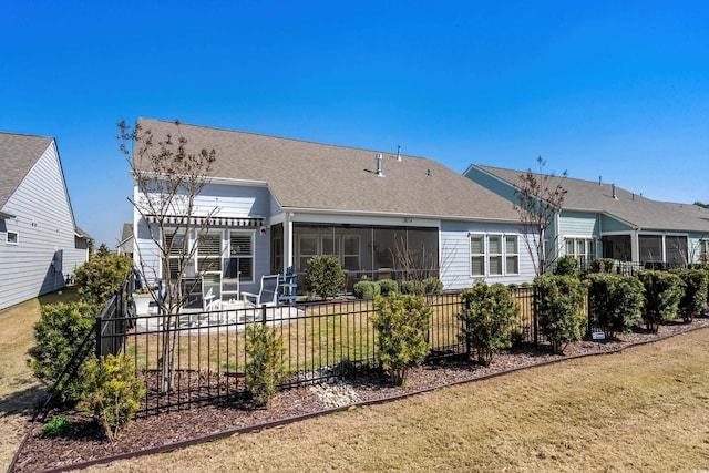 rear view of property with a patio, fence, a pergola, a sunroom, and a shingled roof