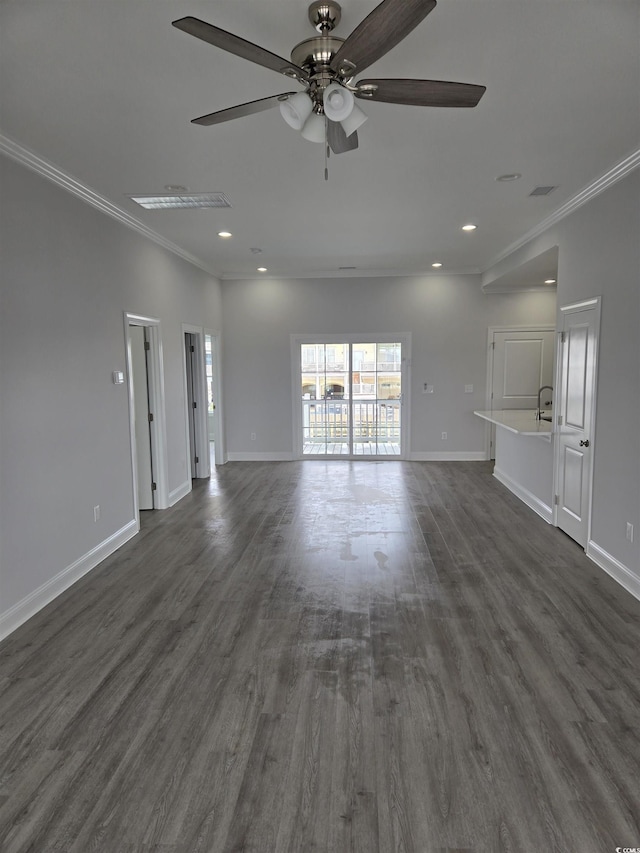 unfurnished living room with crown molding, baseboards, recessed lighting, dark wood-style floors, and a ceiling fan