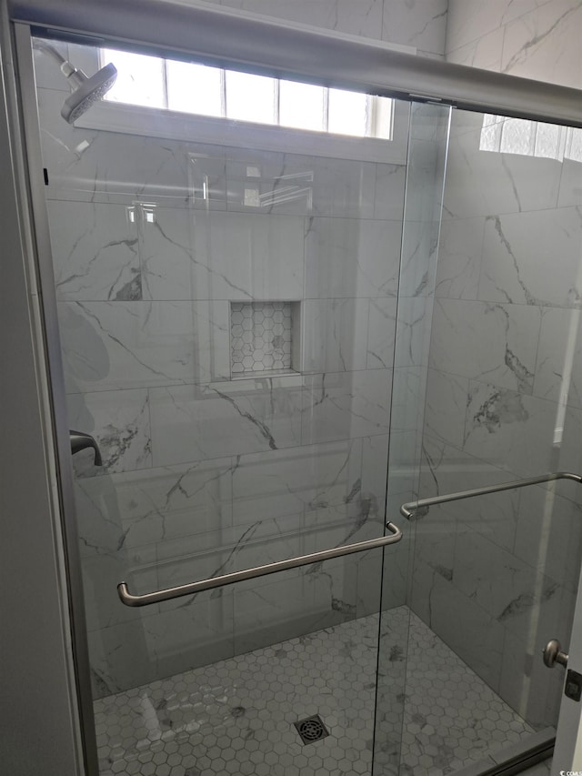 full bathroom featuring a stall shower