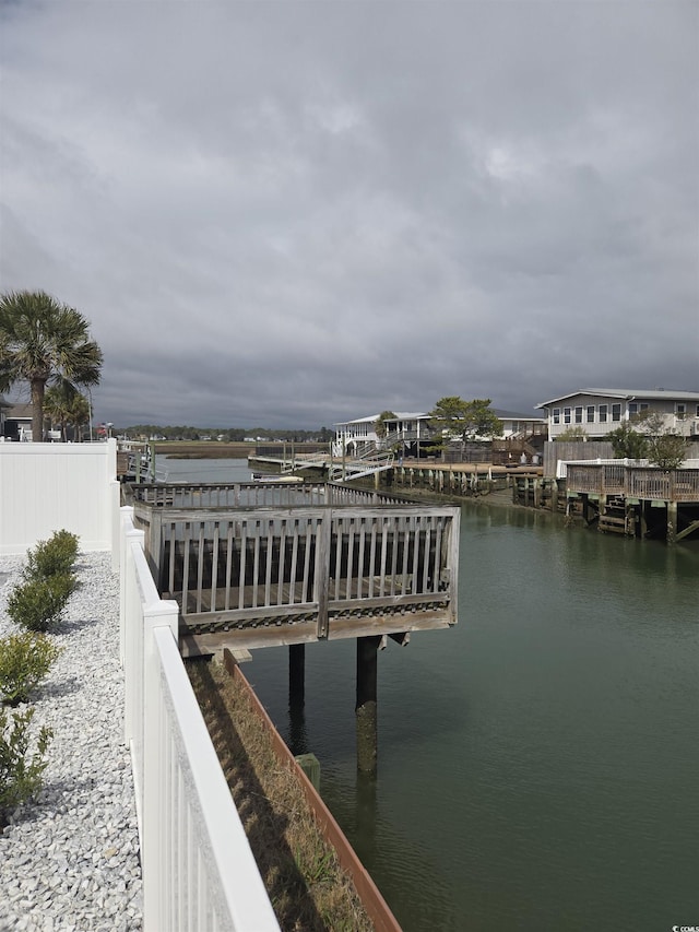 dock area featuring a water view