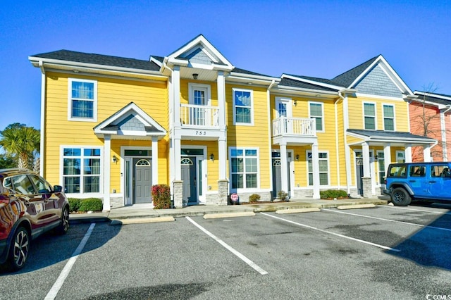 view of property featuring uncovered parking