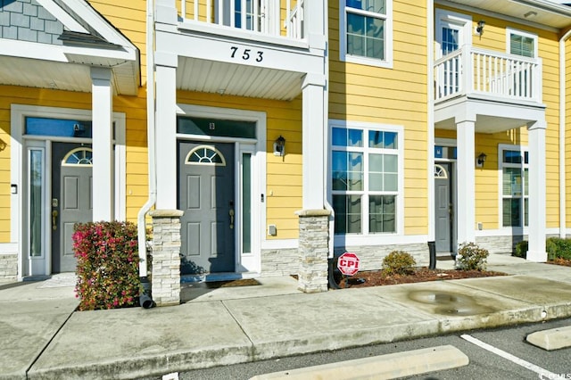 doorway to property featuring stone siding