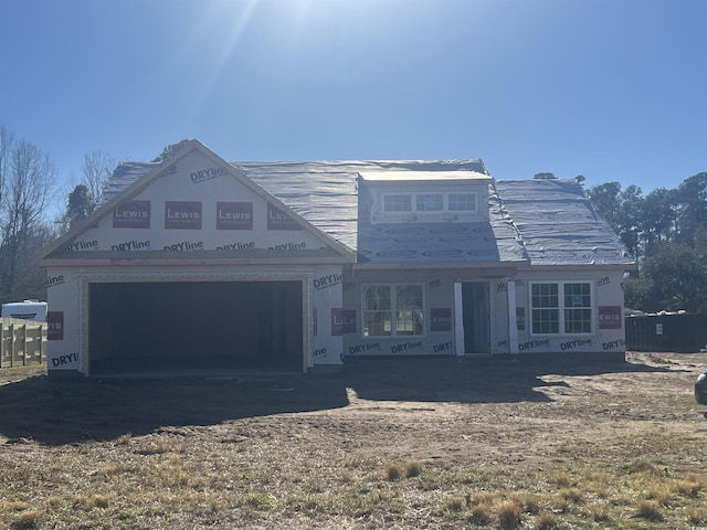 property in mid-construction featuring a garage