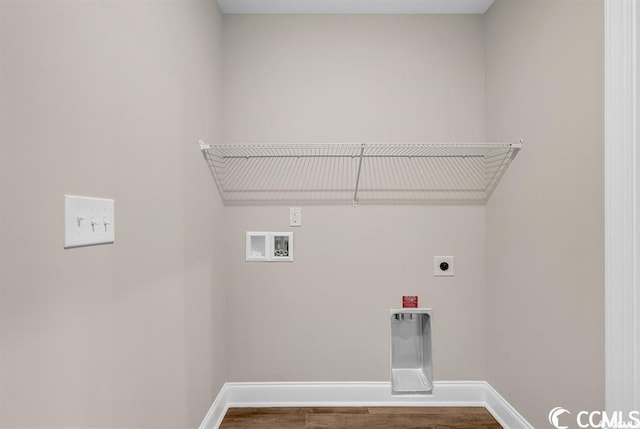 laundry room with laundry area, hookup for a washing machine, baseboards, and hookup for an electric dryer