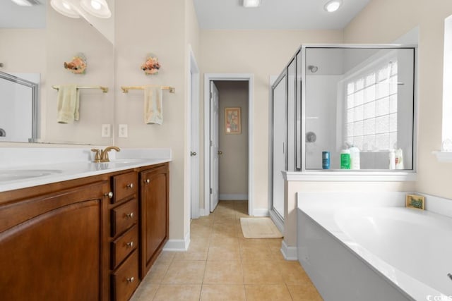 bathroom with tile patterned flooring, a shower stall, and a bath